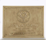 Brass plaque with 'Jo Latham Fine Jewelry' logo and text on a white background