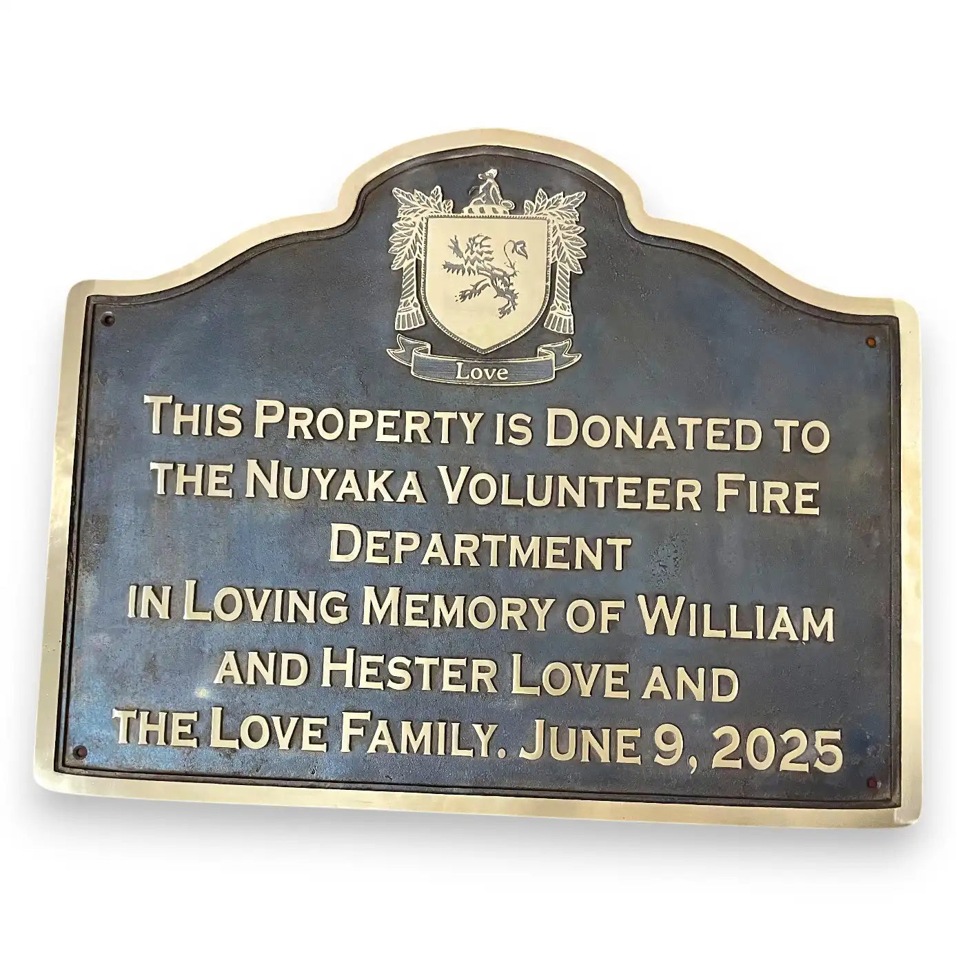 Bronze Donation plaque for the Nuyaka Volunteer Fire Department with a family name and date.