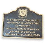 Bronze Donation plaque for the Nuyaka Volunteer Fire Department with a family name and date.