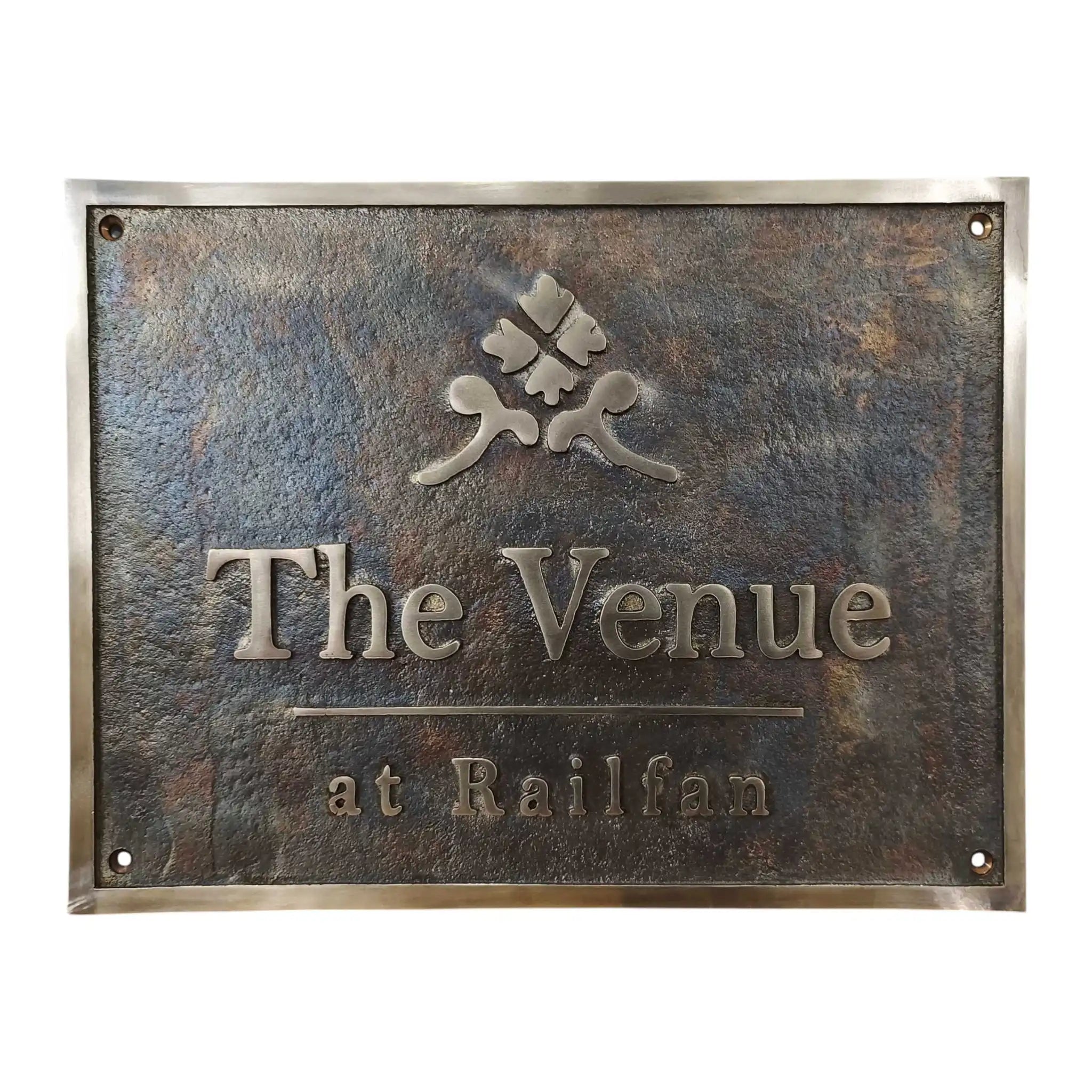 Bronze address sign with 'The Venue at Railfan' text and logo on a white background