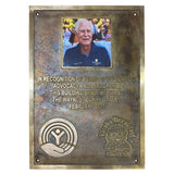 Bronze plaque honoring Wayne C. Clark with a photo of a man and engraved text.