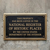 National register of historic place bronze plaque - Plaque on a concrete wall indicating listing in the National Register of Historic Places.