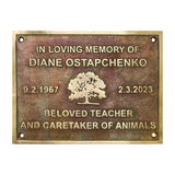 Bronze Memorial plaque for Diane Ostapchenko with a tree design on a white background