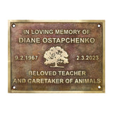 Bronze Memorial plaque for Diane Ostapchenko with a tree design on a white background