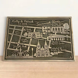 Personalized map plaque of Savannah, Georgia on a wooden surface with a white background