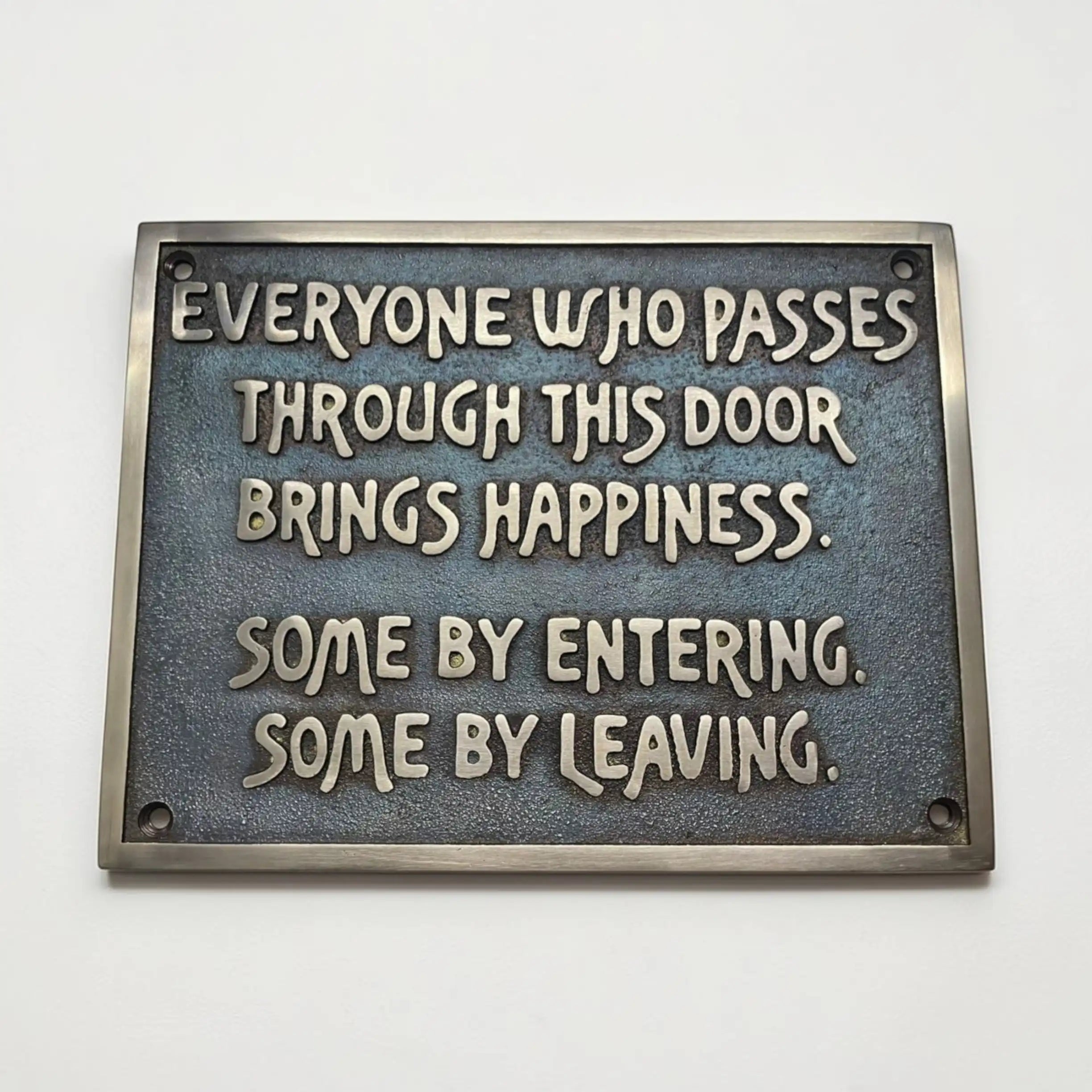Personalized bronze plaque with motivational quote on a white background
