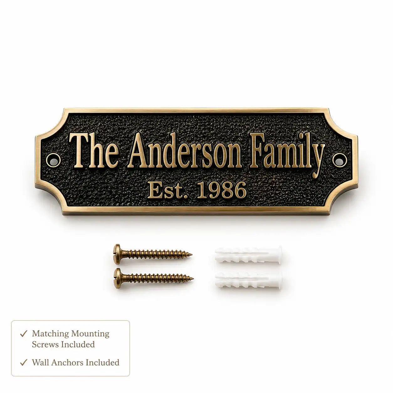 Custom family nameplate plaque with a black textured background and gold lettering, shown with two gold mounting screws and two white wall anchors on a white background. A small text box at the bottom left notes that matching mounting screws and wall anchors are included.