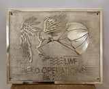 Bronze plaque with an eagle and parachute design, featuring 'LWF Field Operations Est. 2023'.