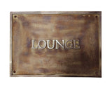 Bronze plaque with 'LOUNGE' text on a white background