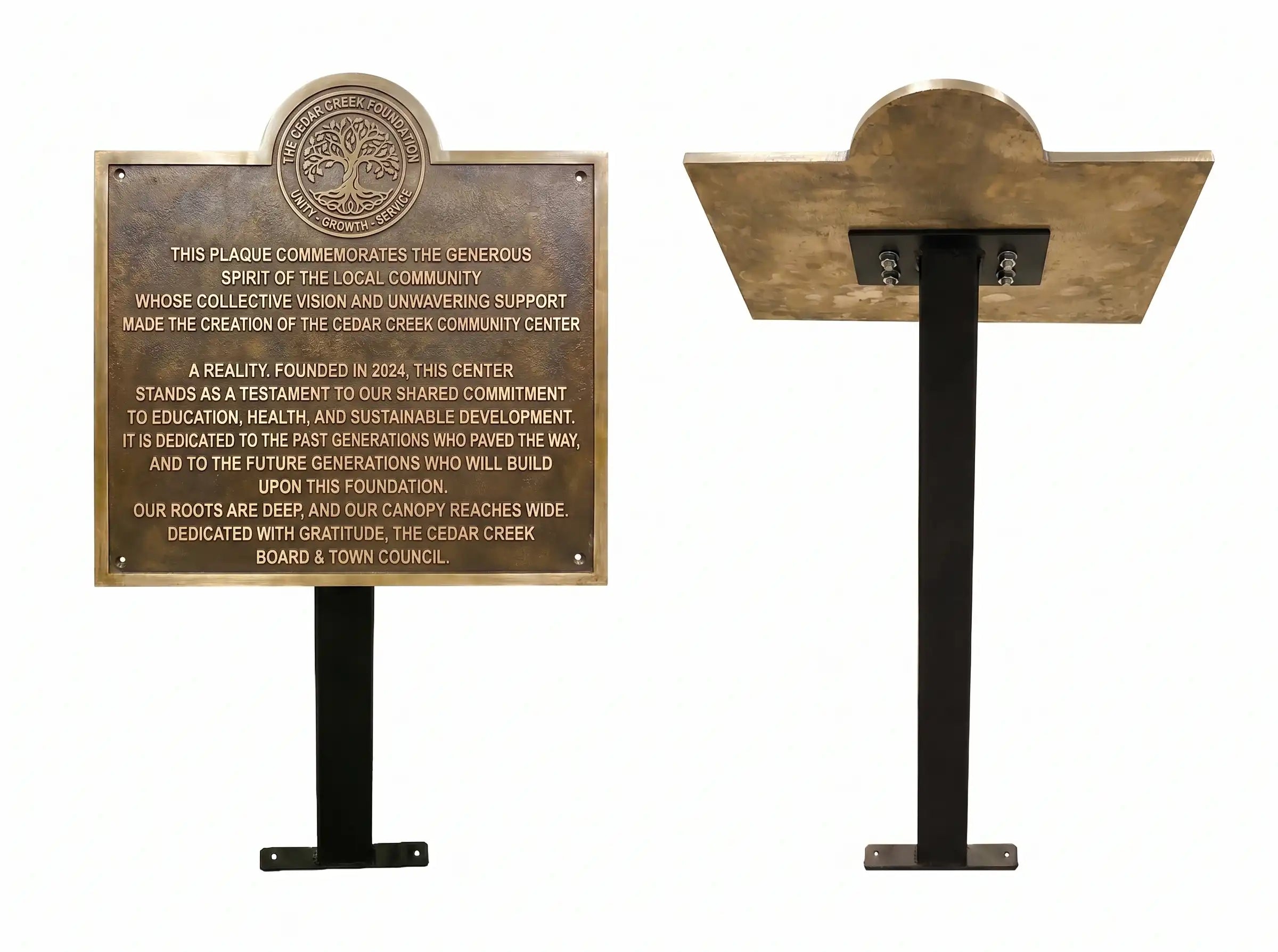 Bronze plaque on a stand with engraved text on a white background
