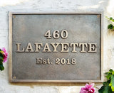 Custom Bronze Plaque – Bronze address plaque installed at a front entrance