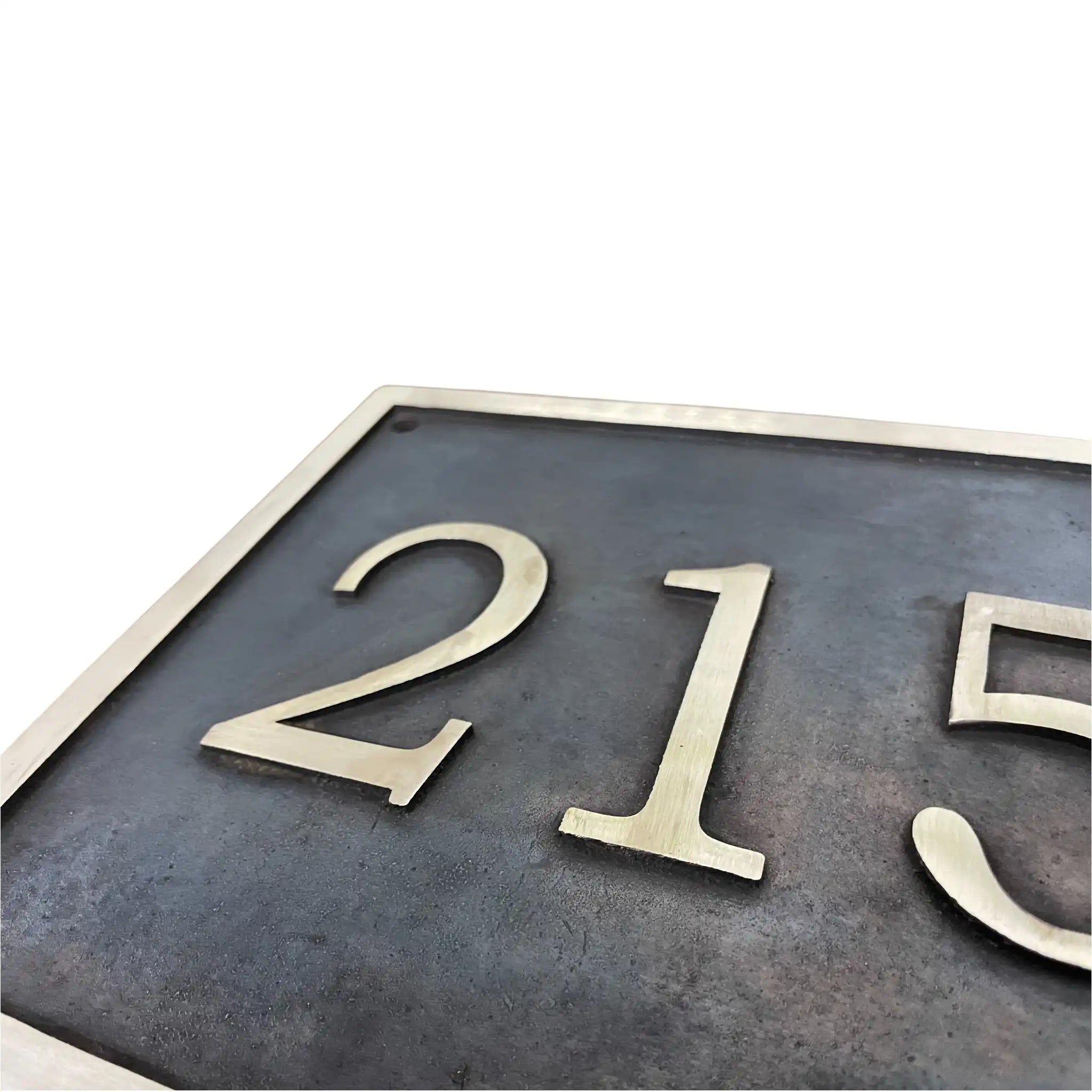 Metallic house number plate Cast bronze address plaque on white background