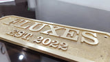 Custom cast brass nameplate for door installation