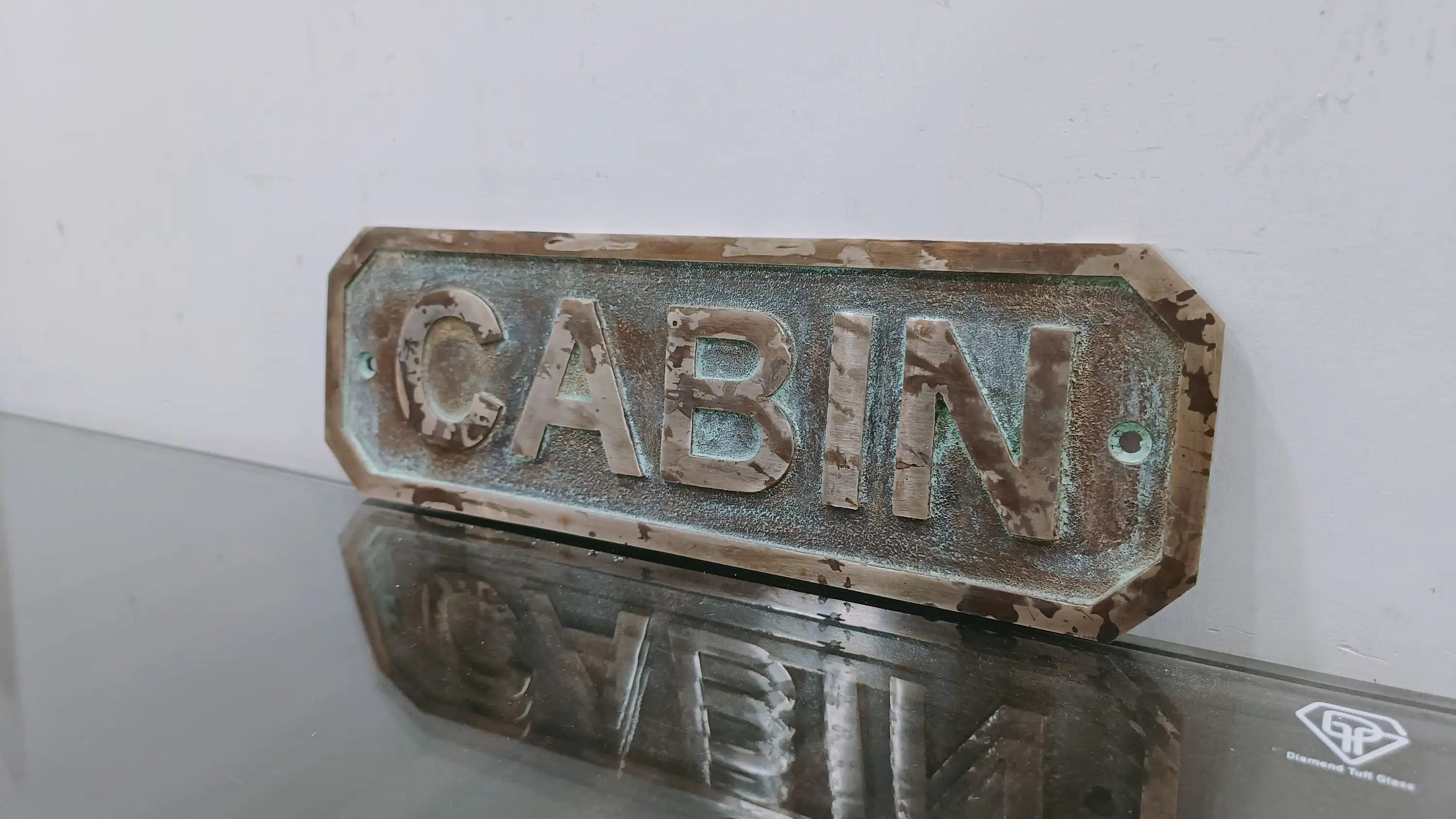 Custom engraved brass name plate with patina finish