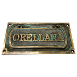 Decorative mail slot for door shown from side angle view