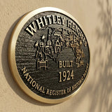 Historical Bronze plaque with 'Whitley Heights' and 'Built 1924' on a beige wall.