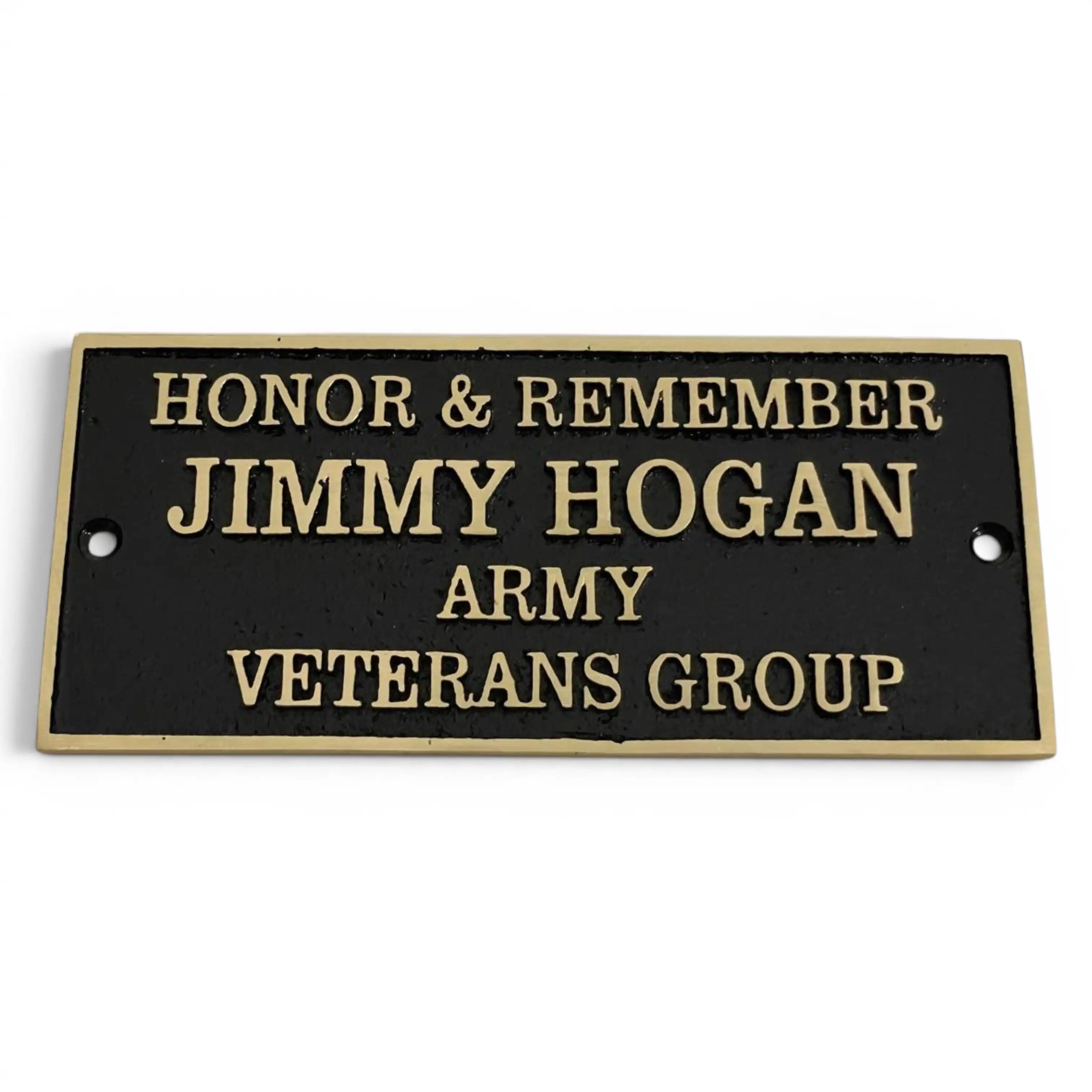 A rectangular black metal commemorative plaque with raised gold lettering that reads 'HONOR & REMEMBER JIMMY HOGAN ARMY VETERANS GROUP', shown on a plain white background.