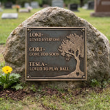 Memorial plaque with engraved text on a stone in a cemetery