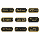 Nine personalized house nameplate options shown on a plain white background, each with a black textured face, gold border, and gold lettering for phrases such as Johnson Family, Welcome, Office, Reception, Suite 203, Memorial Garden, The Smiths, 125 Oak Street, and Private Property.