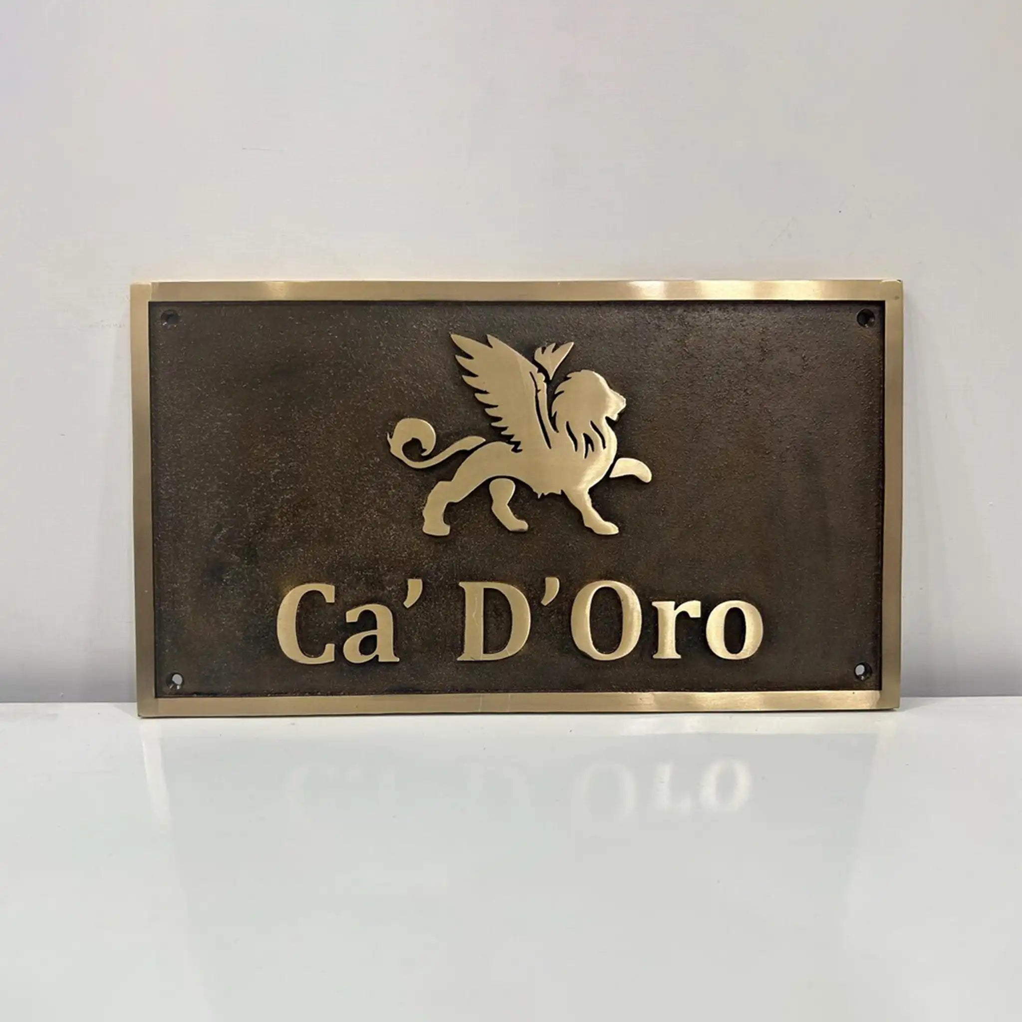 Custom bronze sign for outdoor use with custom text and logo