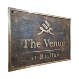 Cast Bronze sign with 'The Venue at Railfan' text and logo on a white background
