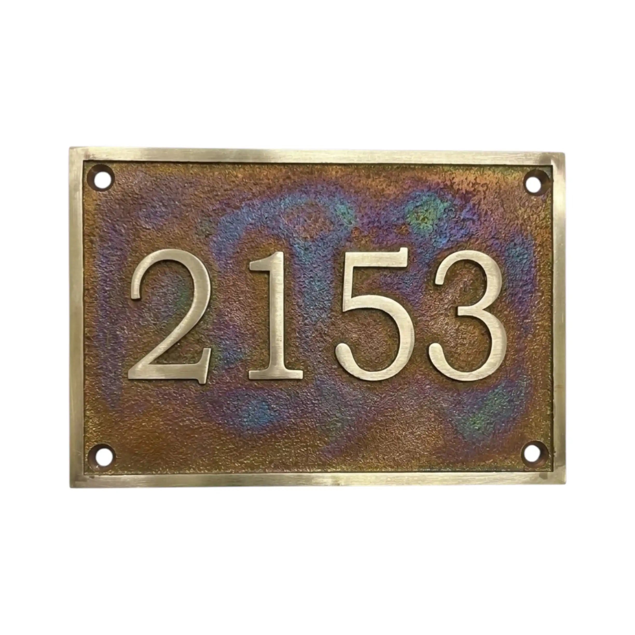Rectangular bronze house number plate with '2153' on a white background
