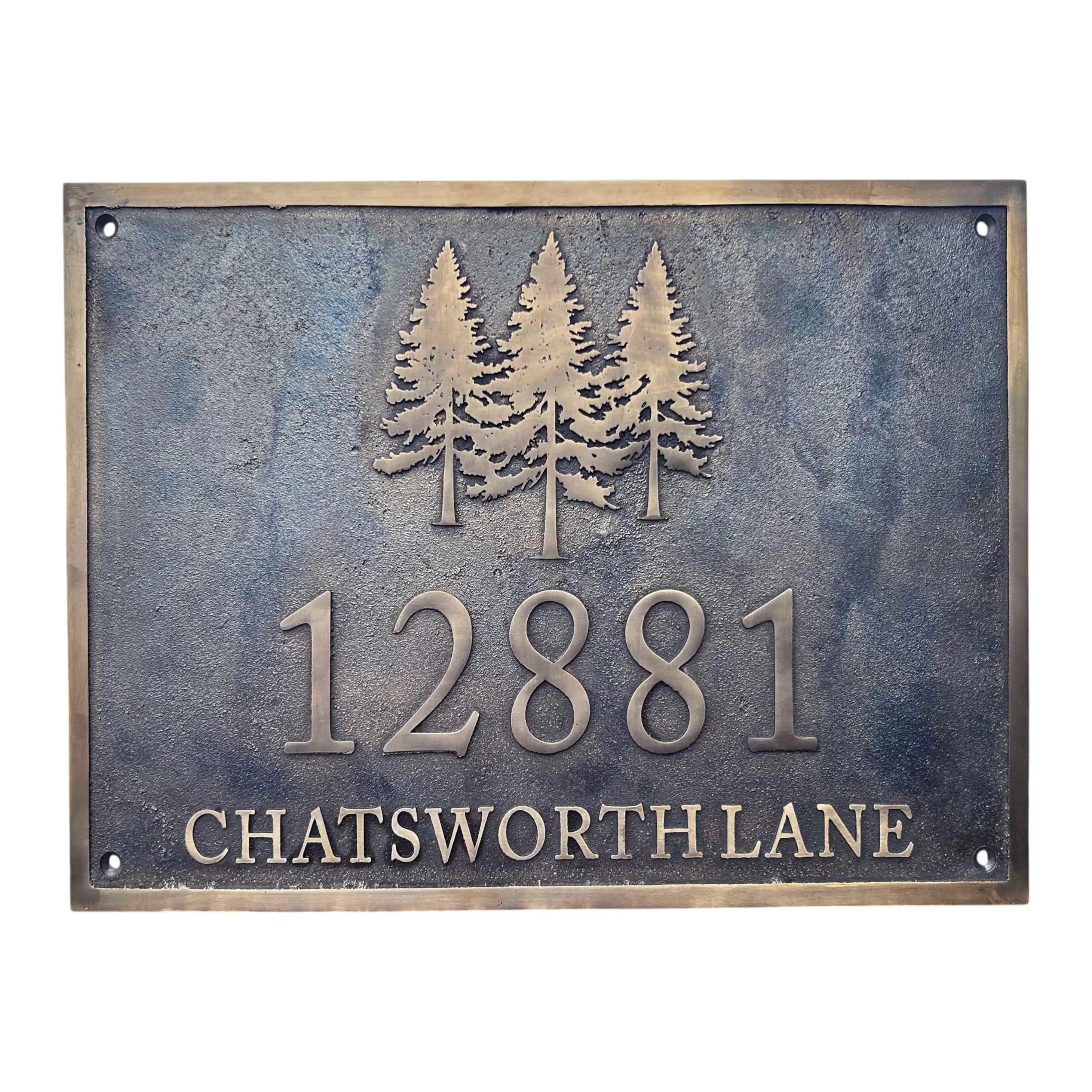 Bronze sign with trees and text '12881 CHATSWORTH LANE' on a textured background