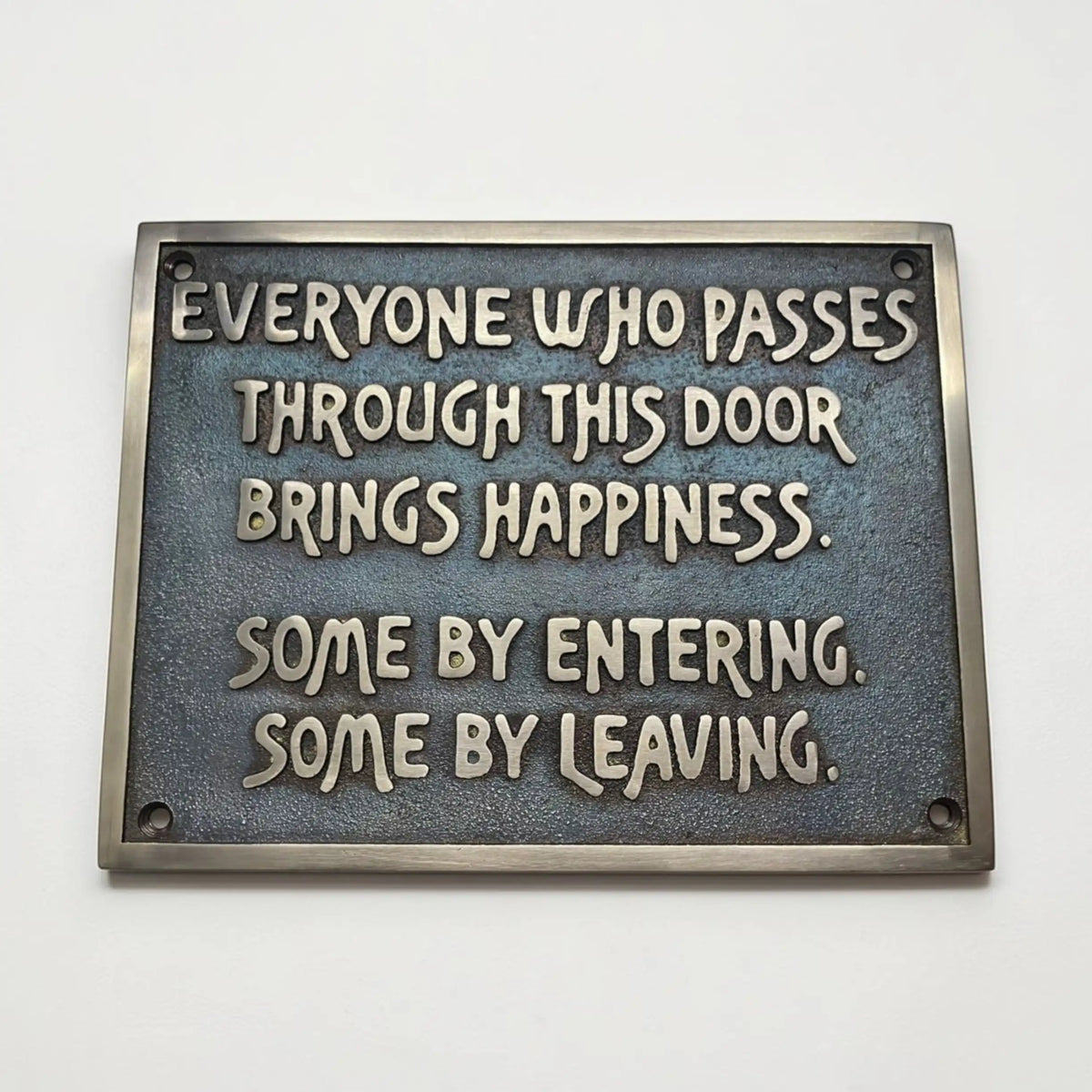 Personalized bronze plaque with motivational quote on a white background