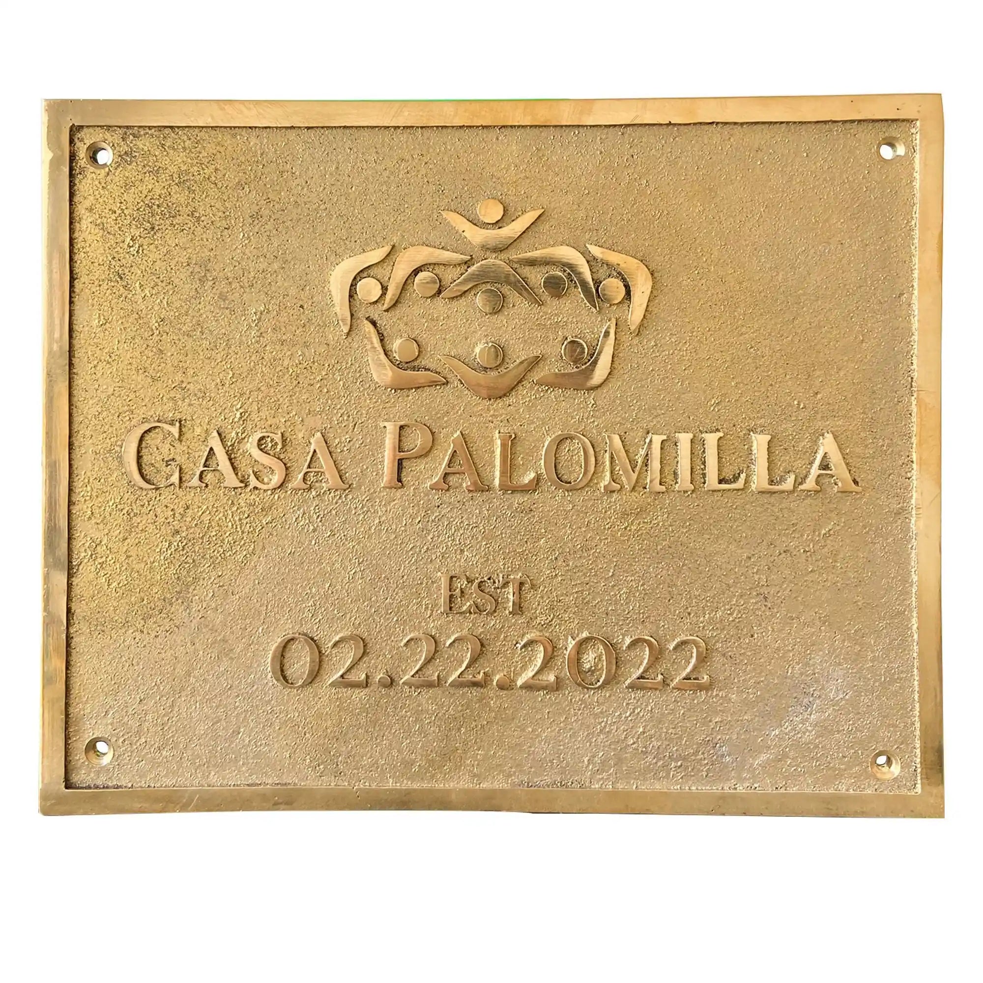 Gold plaque with 'Casa Palomilla' and establishment date on a white background