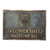 Metallic plaque with a crest and text on a white background