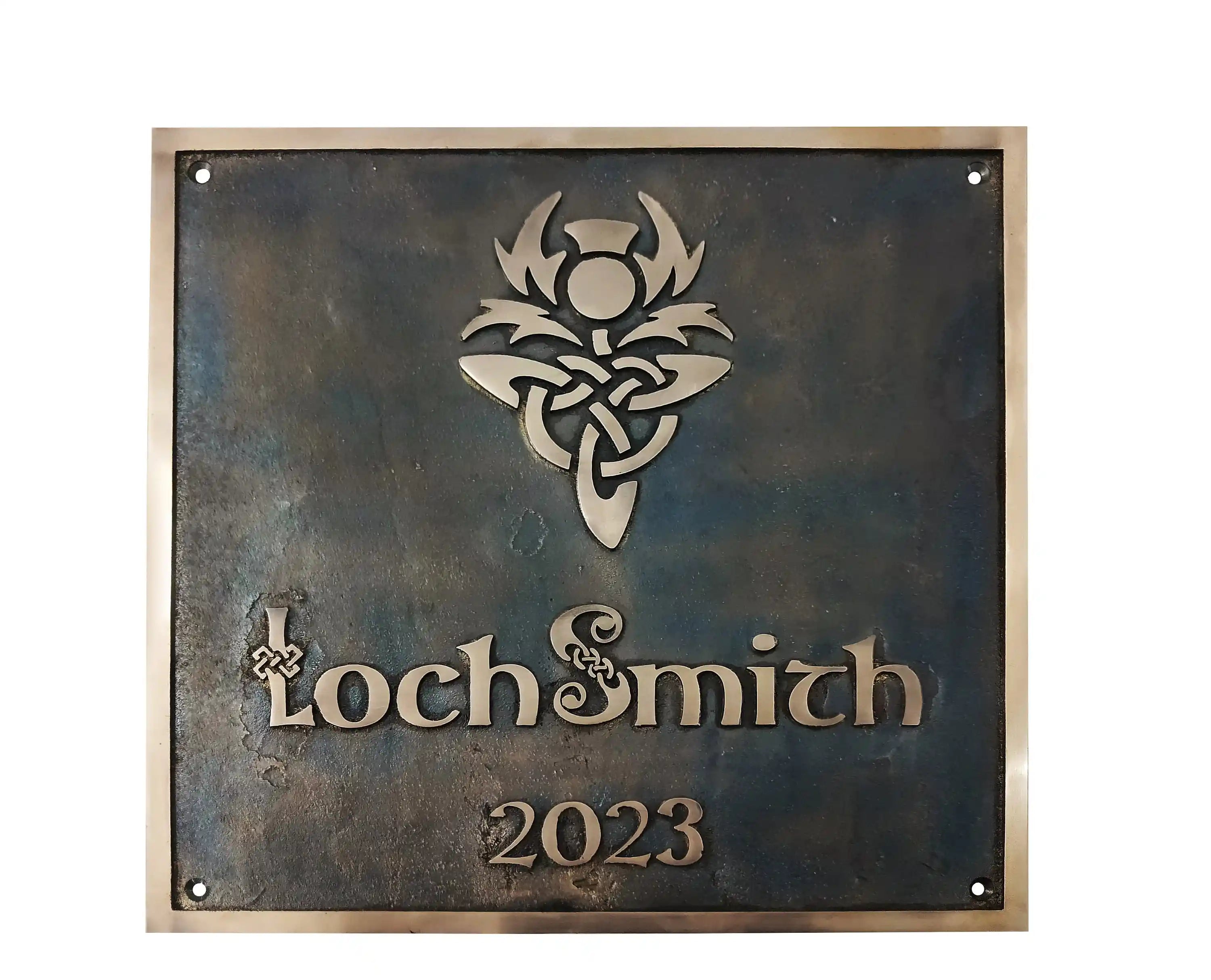 Decorative metal sign with 'Loch Smith' and '2023' on a dark background