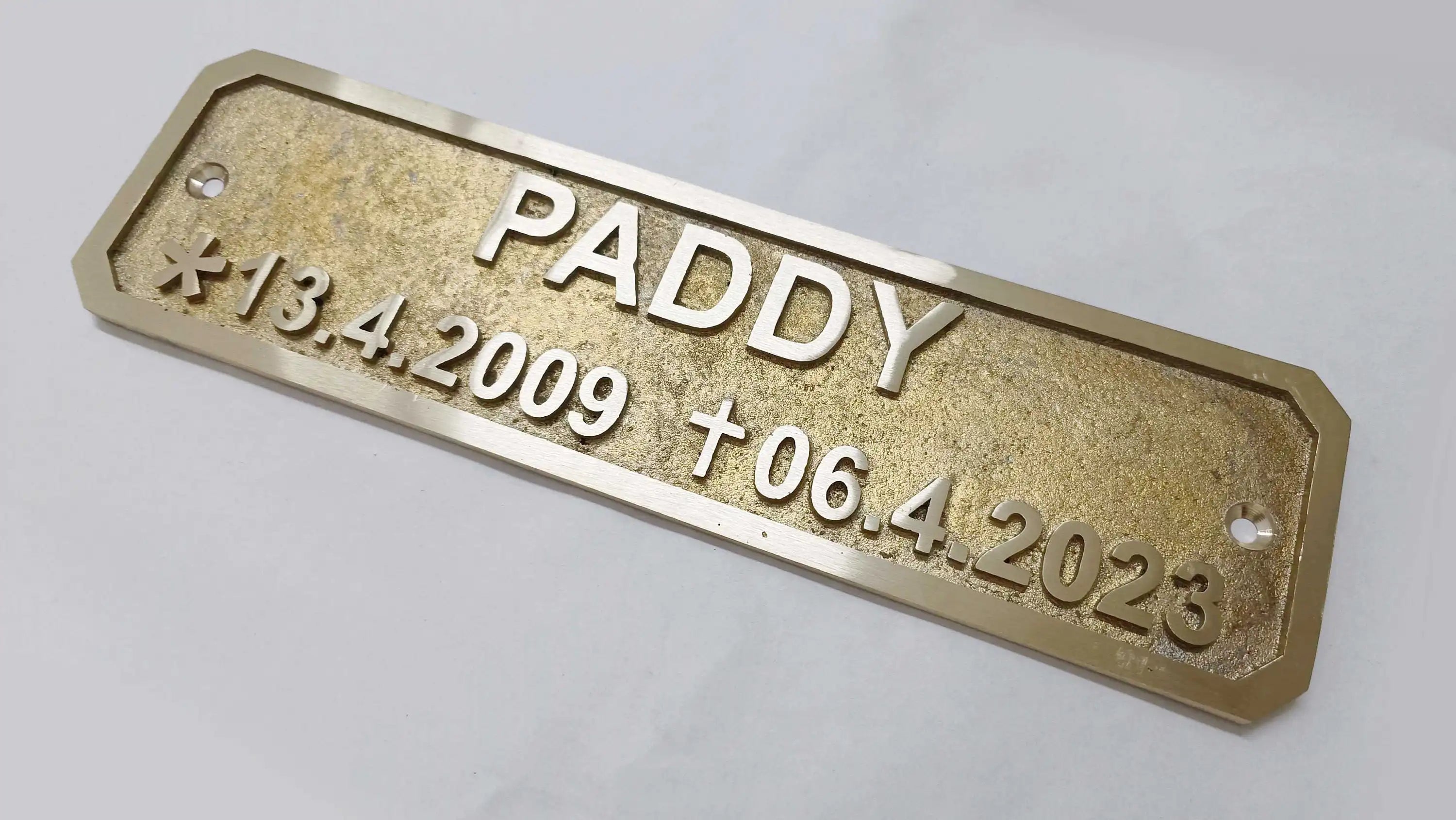 Traditional cast brass plaque with raised lettering