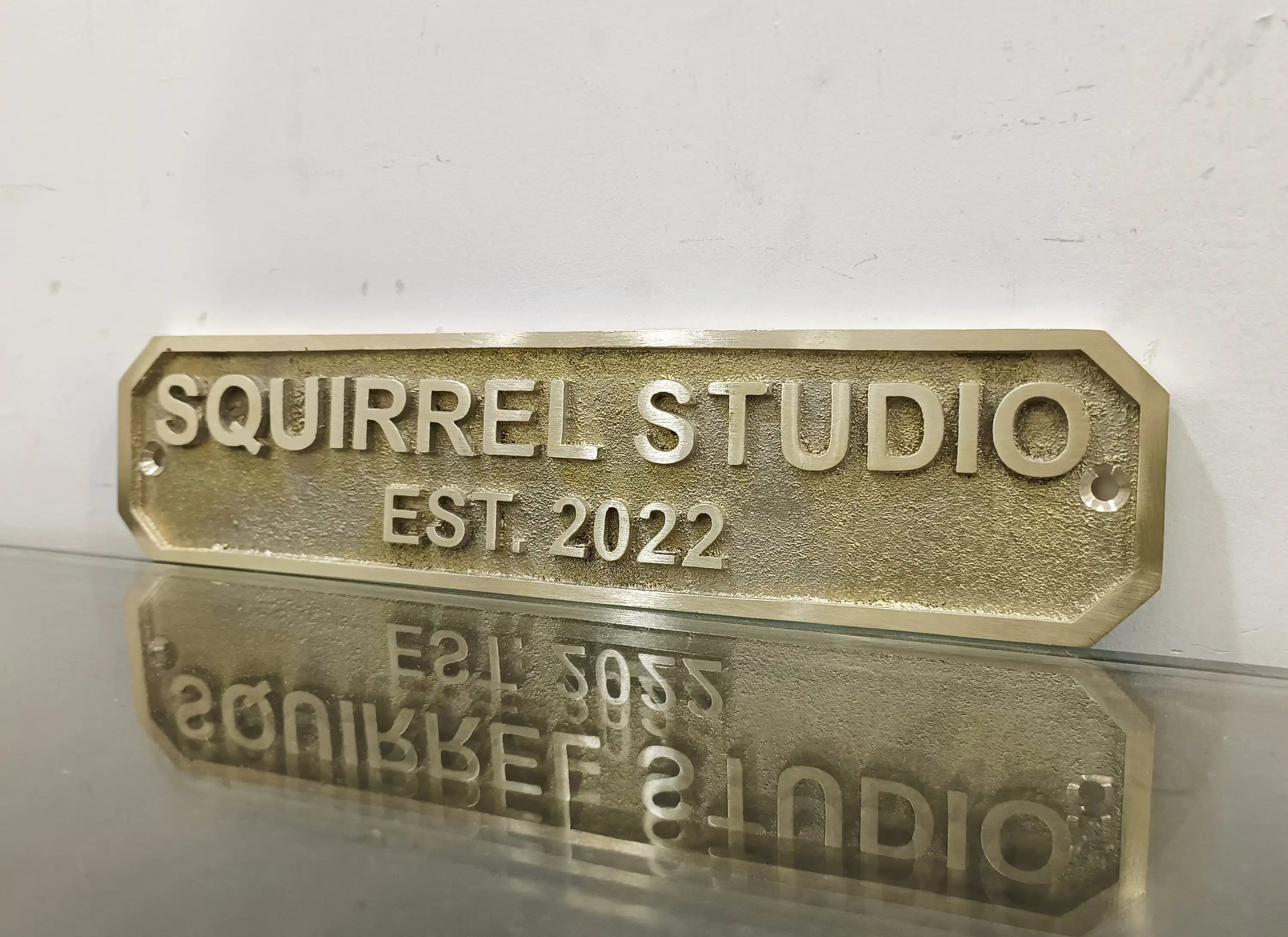 Brass door sign with custom engraved text and date