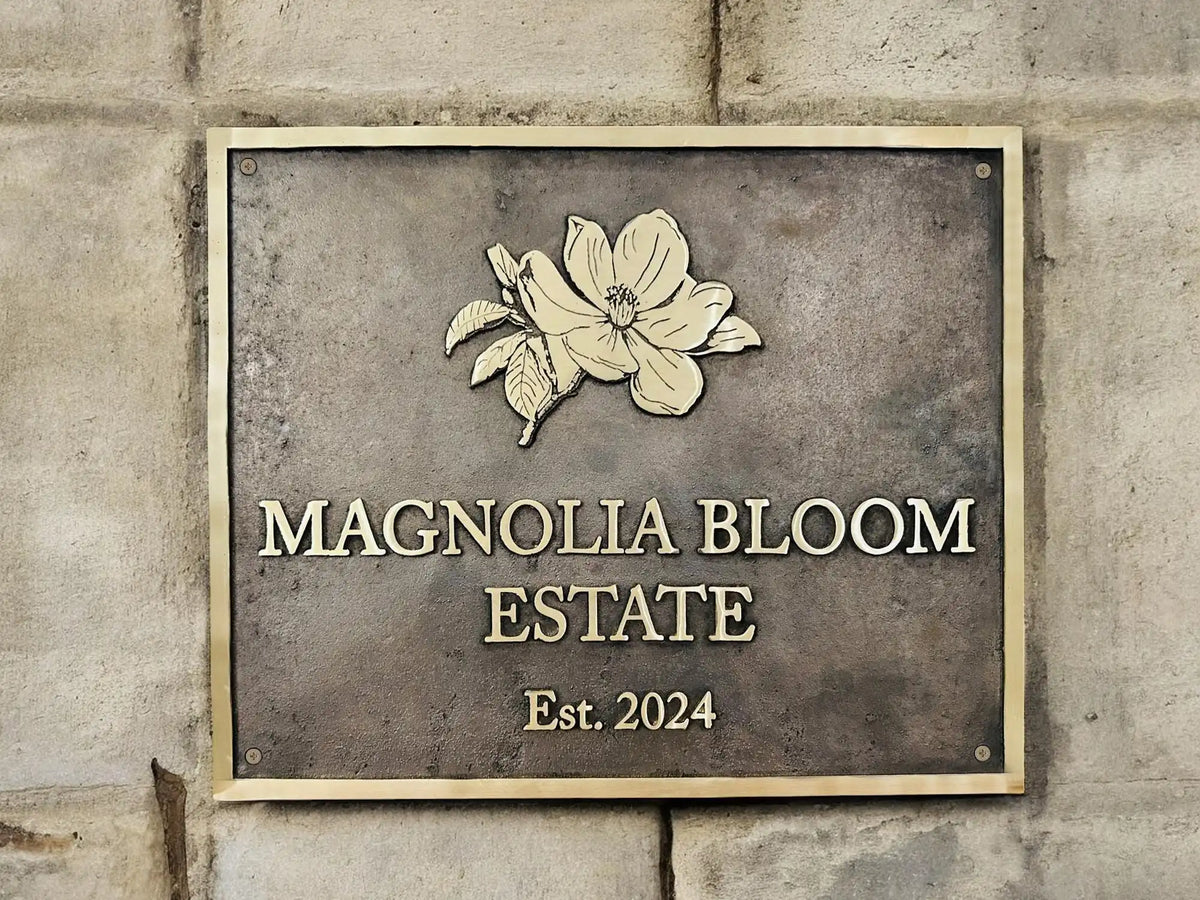 Bronze address plaque mounted on an exterior wall