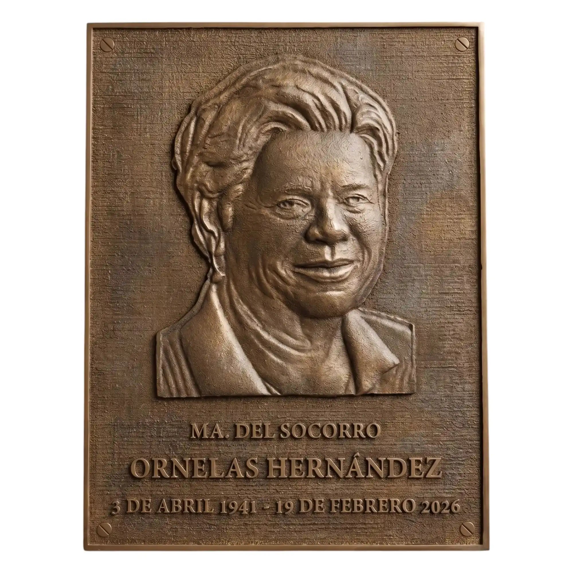 Bronze plaque with a portrait and engraved text on a white background