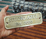 Close up detail of cast brass plaque engraving