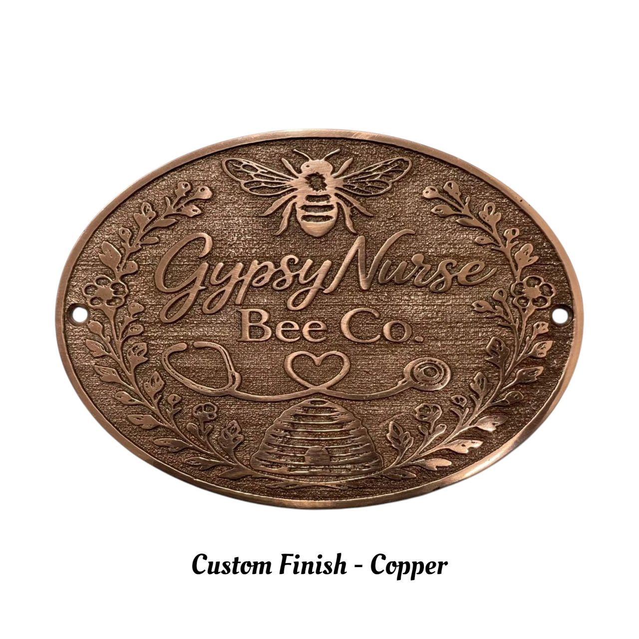 Bronze plaque with 'Gypsy Nurse Bee Co' text and bee design on a white background