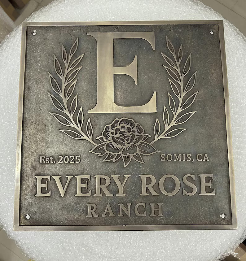 Custom Bronze Plaques -  Address Plaques with 'E' and floral design, featuring 'Every Rose Ranch' text.