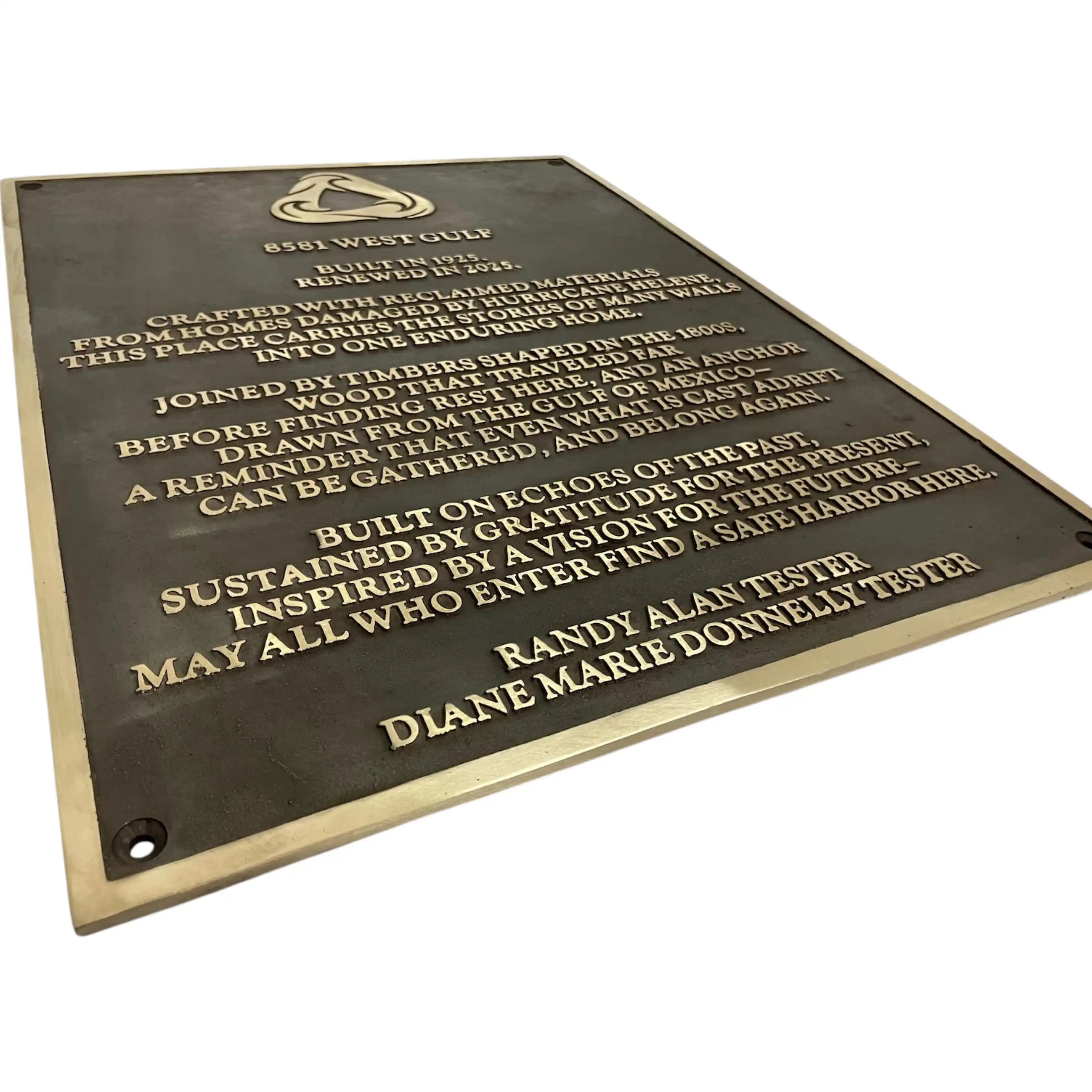 A rectangular bronze memorial plaque with engraved gold lettering, shown at an angle against a plain white background. The plaque features the West Gulf Wood Cup logo at the top and the names Randy Alan Tester and Diane Marie Donnelly Tester at the bottom.