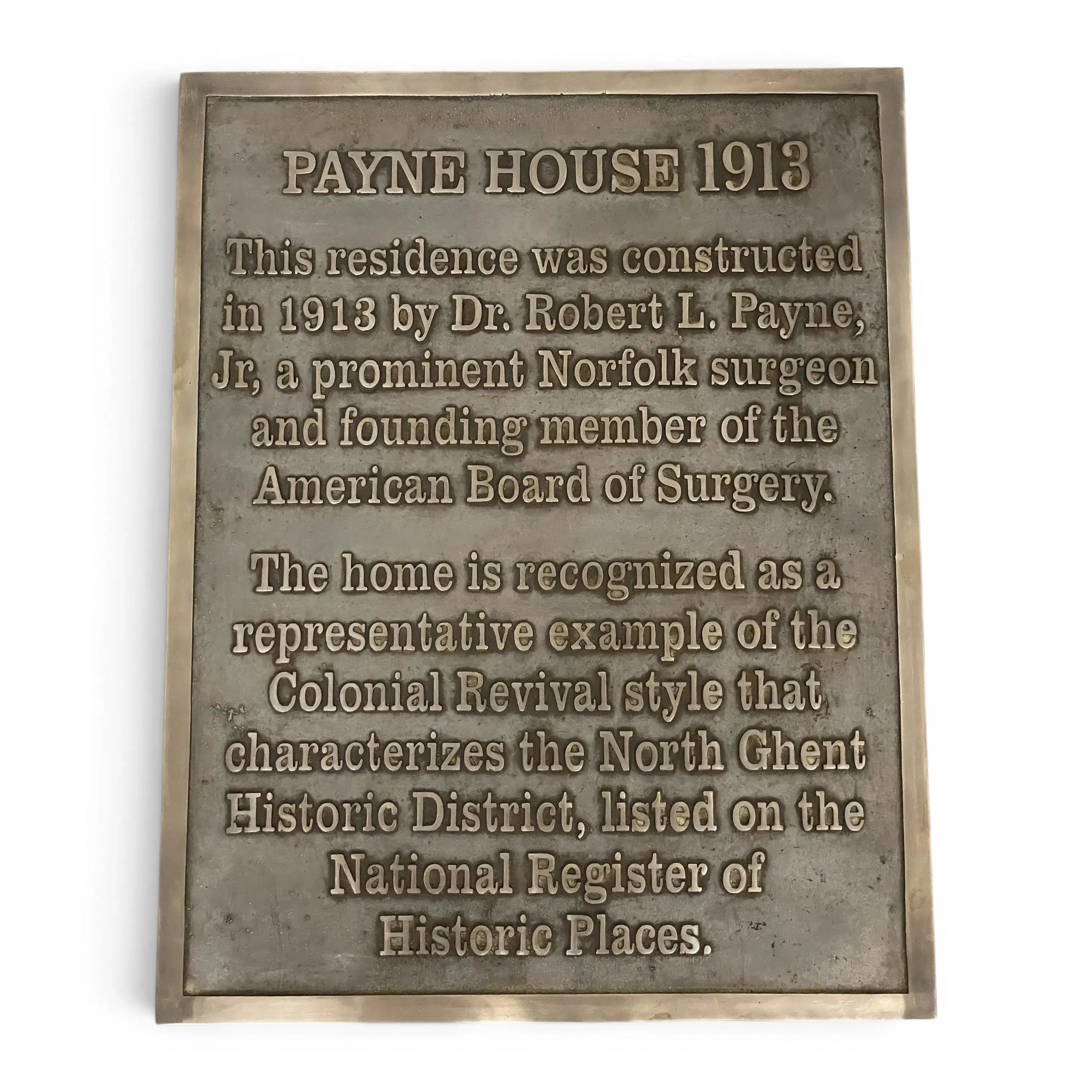 A rectangular bronze-colored metal historical plaque for 'Payne House 1913' with engraved text on a plain white background.