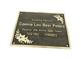Memorial plaque with engraved text on a white background