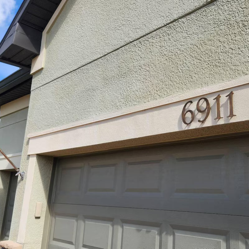 Large custom solid bronze house numbers with oil rubbed bronze finish for estate entrances and architectural signage.