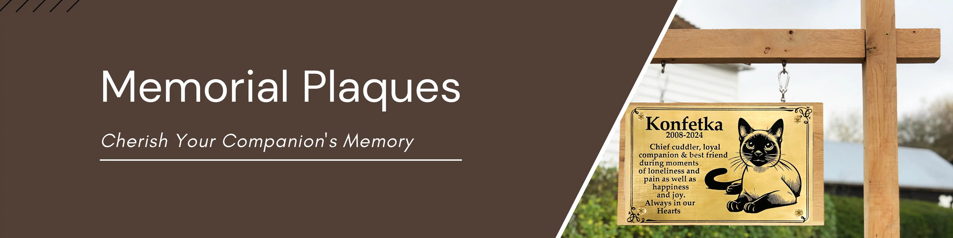 Memorial plaque with a cat design and text, displayed outdoors.